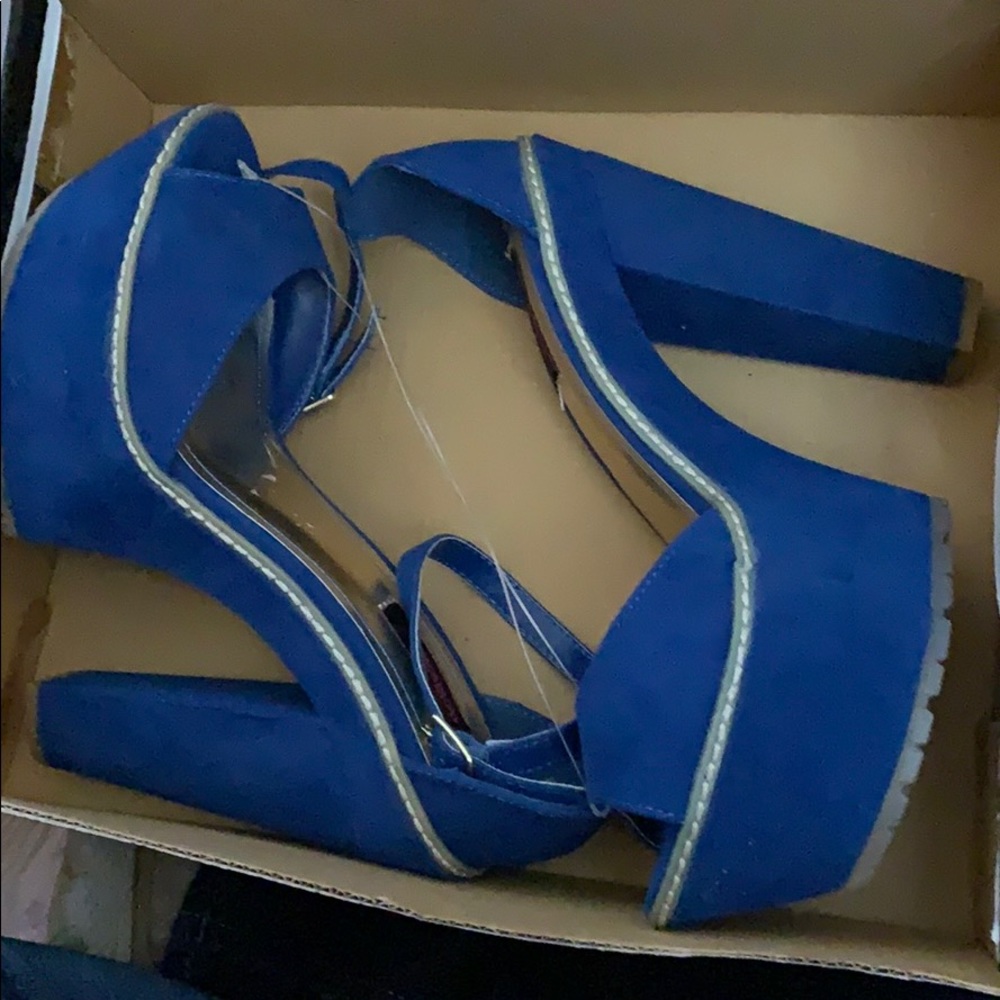 Blue high heel shoes. New in box